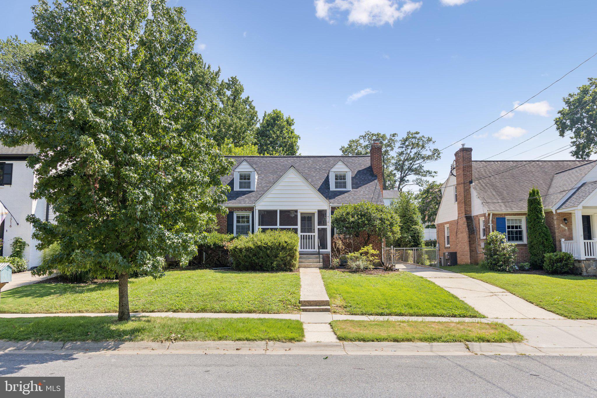 1718 Dublin Drive Silver Spring, MD 20902 - Photo 1 of 25 a front view of a house with a yard