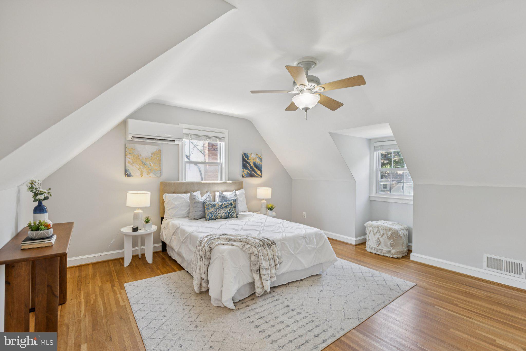 1718 Dublin Drive Silver Spring, MD 20902 - Photo 12 of 25 a bedroom with a bed and a chandelier
