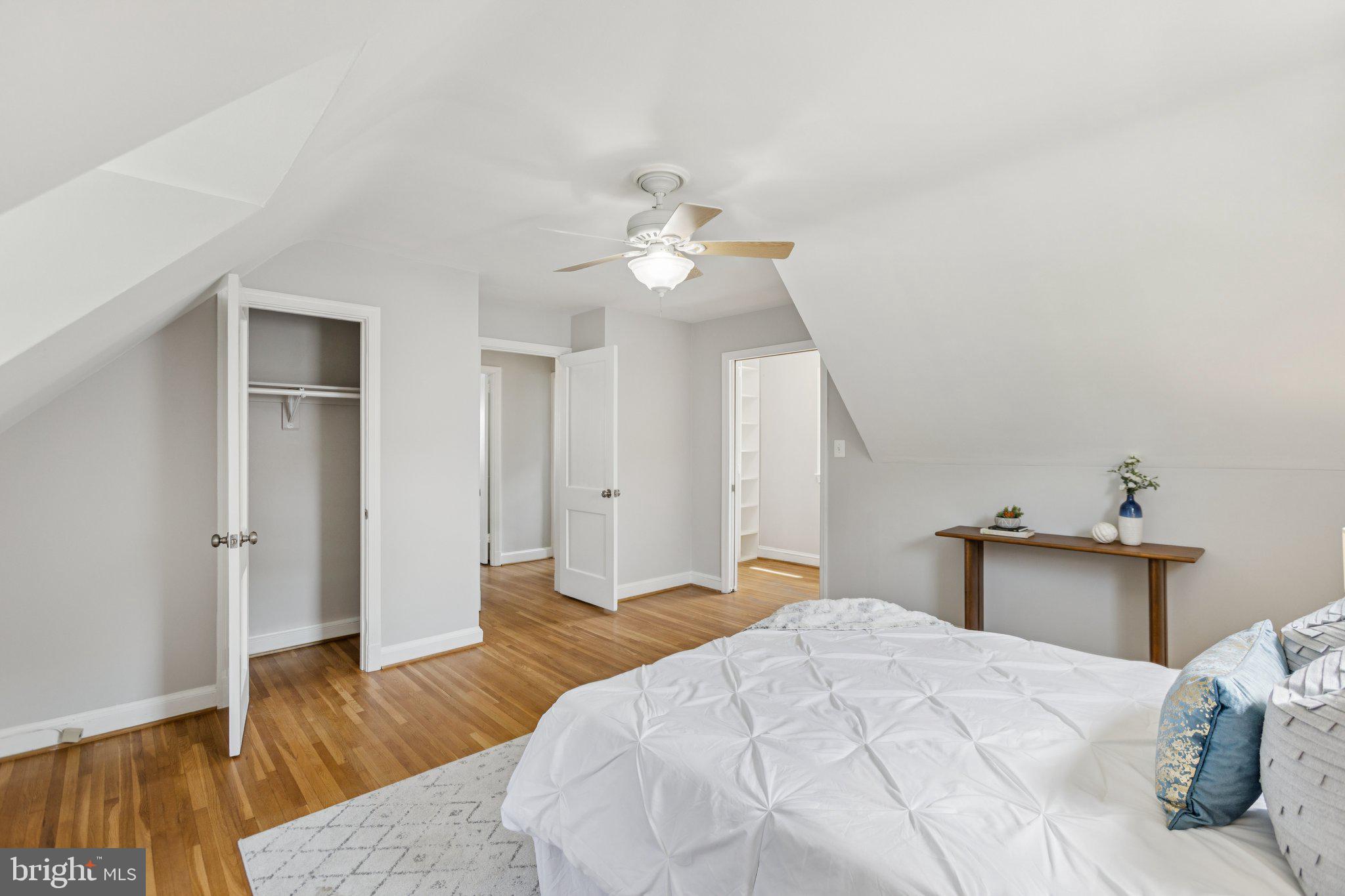 1718 Dublin Drive Silver Spring, MD 20902 - Photo 13 of 25 a bedroom with a bed and wooden floor