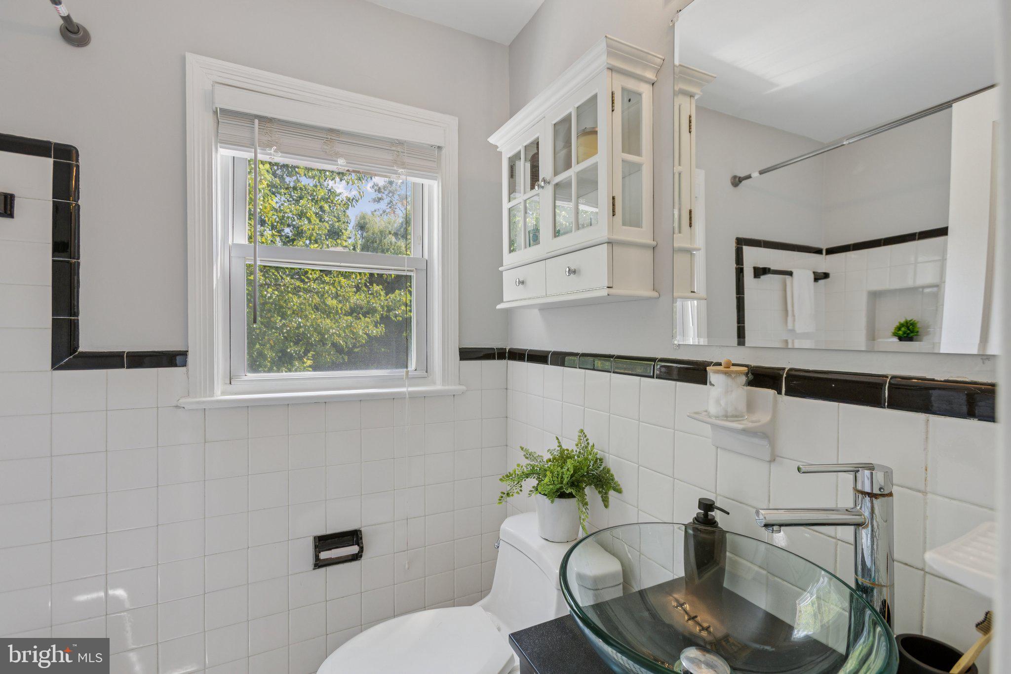 1718 Dublin Drive Silver Spring, MD 20902 - Photo 17 of 25 a bathroom with a toilet and a sink