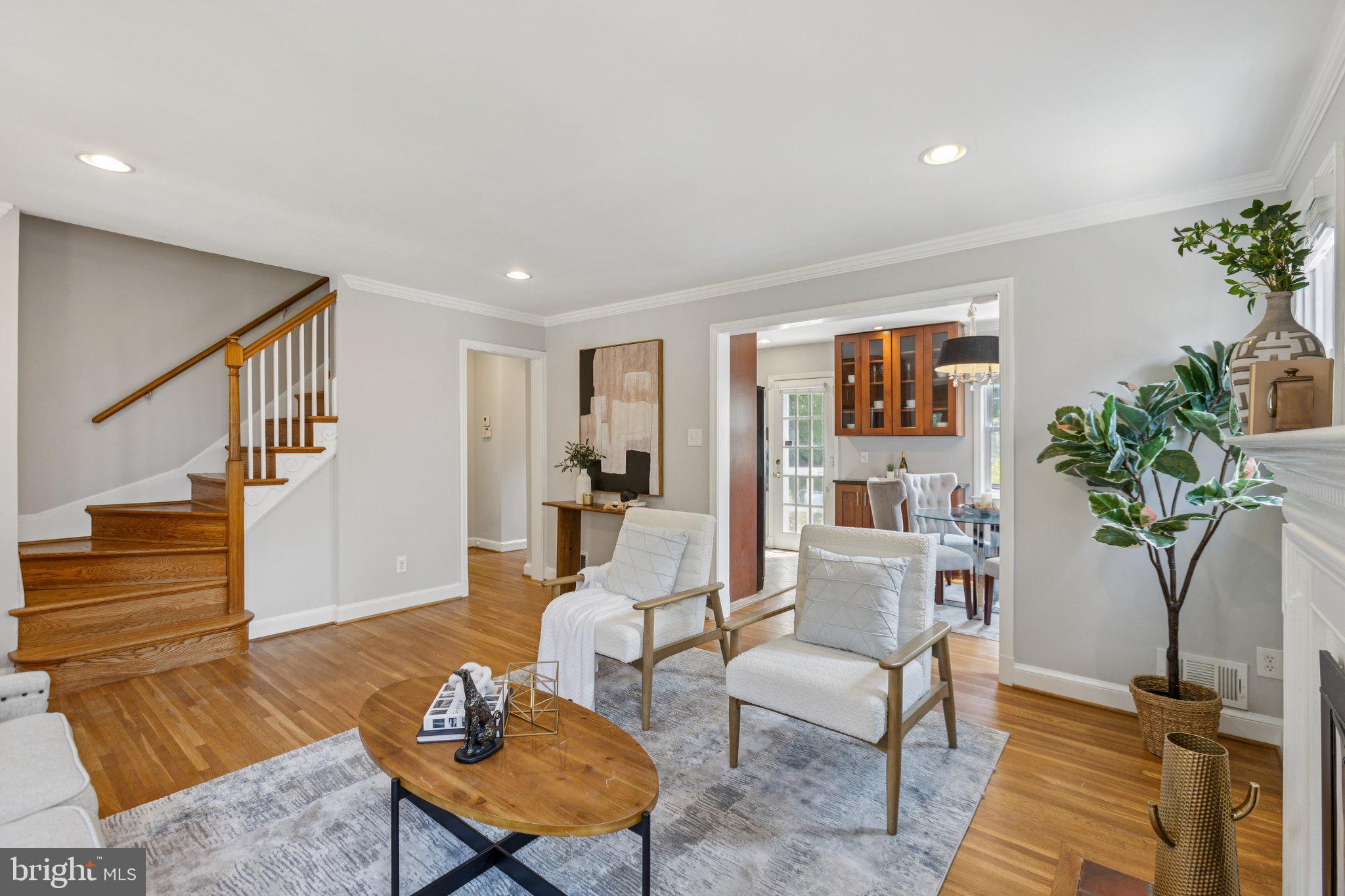 1718 Dublin Drive Silver Spring, MD 20902 - Photo 4 of 25 a living room with furniture a potted plant and a table