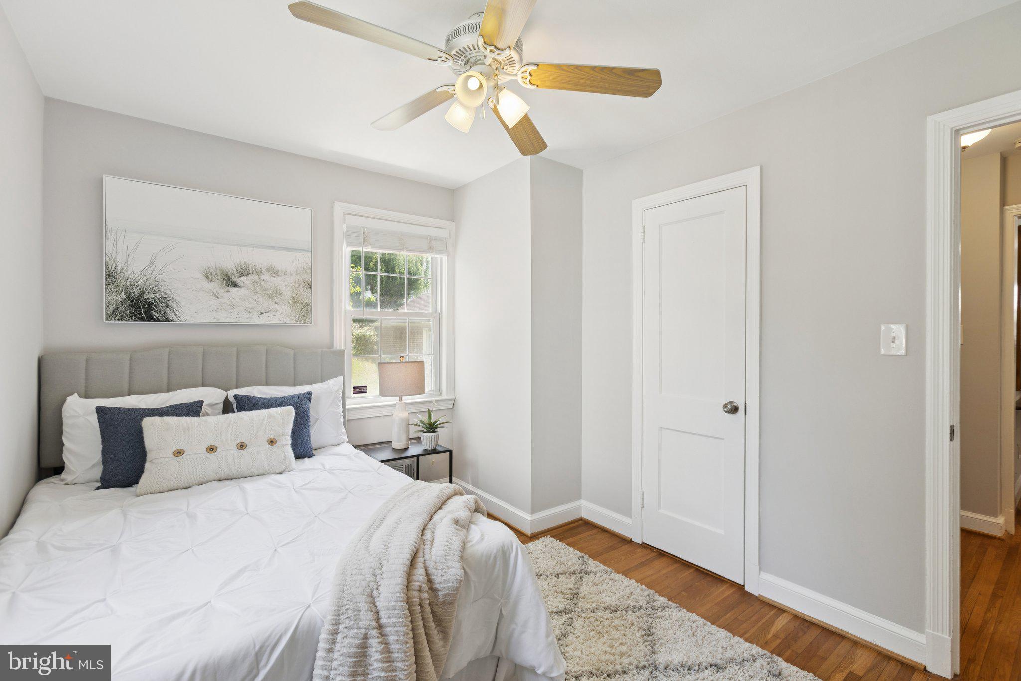 1718 Dublin Drive Silver Spring, MD 20902 - Photo 9 of 25 a bedroom with a large bed and a window