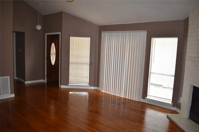 a bathroom with a granite countertop toilet a sink and a mirror