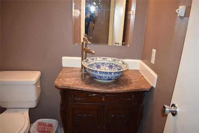 a view of backyard with small cabin and wooden fence