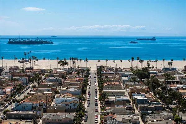 an aerial view of a house with a ocean view