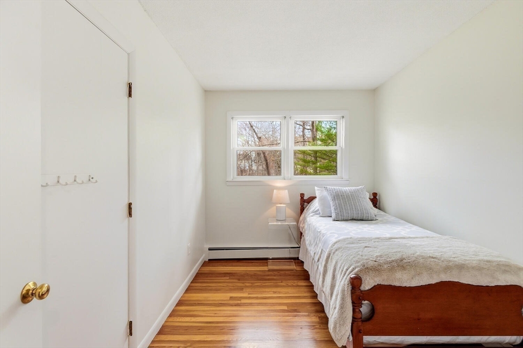 46 Plum Street Hamilton, MA 01982 - Photo 13 of 23 a bedroom with a bed and window
