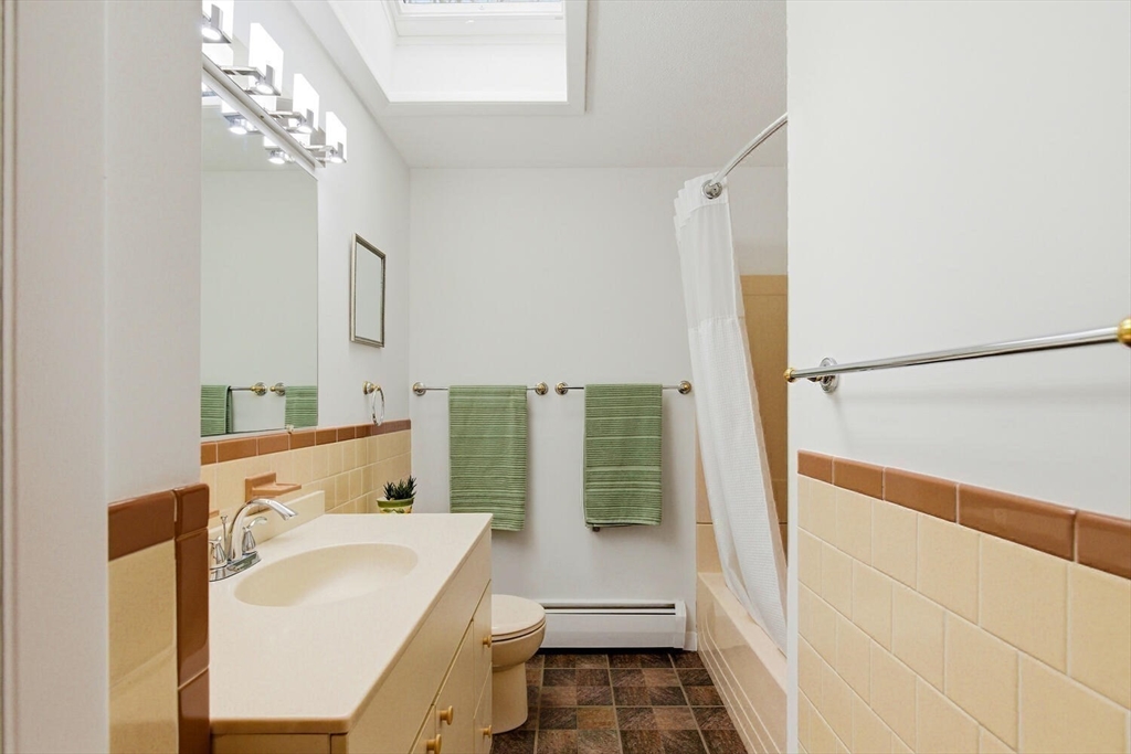 46 Plum Street Hamilton, MA 01982 - Photo 14 of 23 a bathroom with a sink a toilet and shower