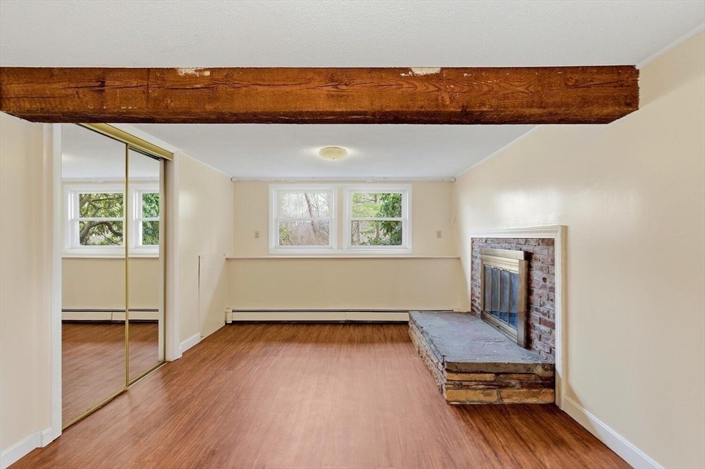 46 Plum Street Hamilton, MA 01982 - Photo 16 of 23 wooden floor with a bed and a window