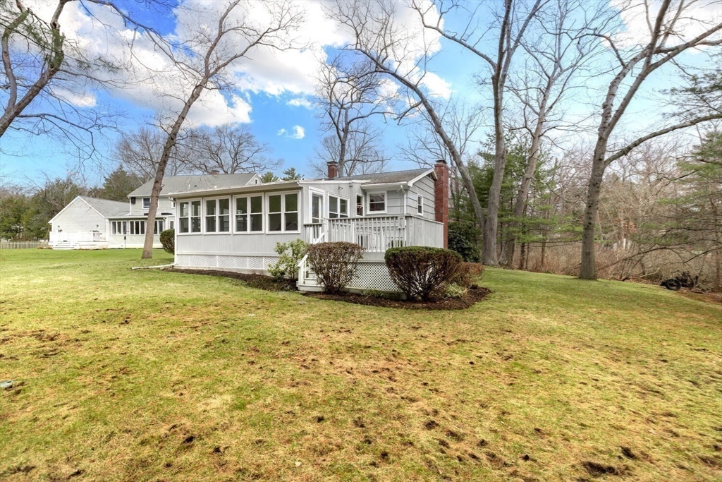 46 Plum Street Hamilton, MA 01982 - Photo 19 of 23 a view of a house with a yard and sitting area