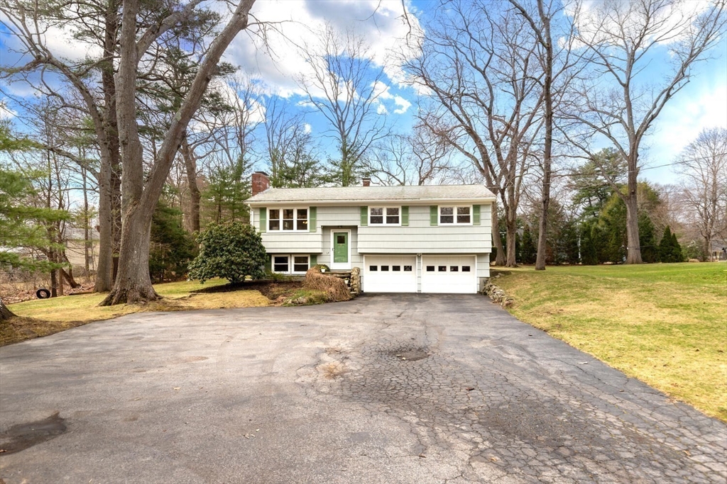 46 Plum Street Hamilton, MA 01982 - Photo 2 of 23 a view of a house with snow on the trees