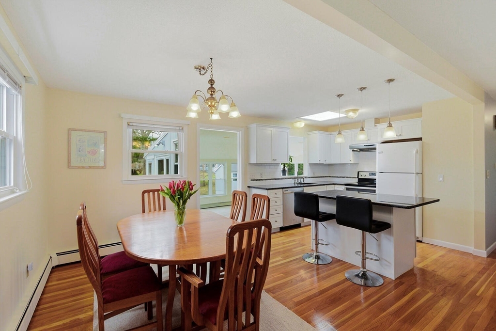 46 Plum Street Hamilton, MA 01982 - Photo 3 of 23 a view of a dining room with furniture and wooden floor