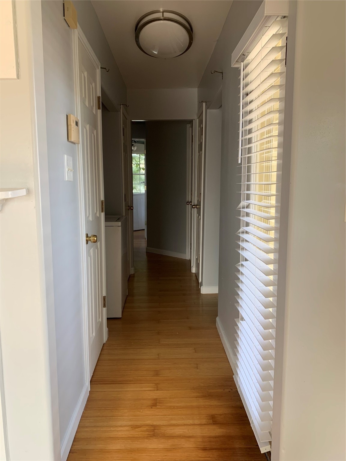 213 1st Street, Unit B Galveston, TX 77550 - Photo 6 of 16 a view of a hallway with wooden floor and staircase