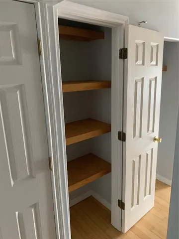a view of bedroom with a small closet
