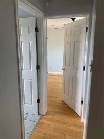 a view of a bathroom from a hallway