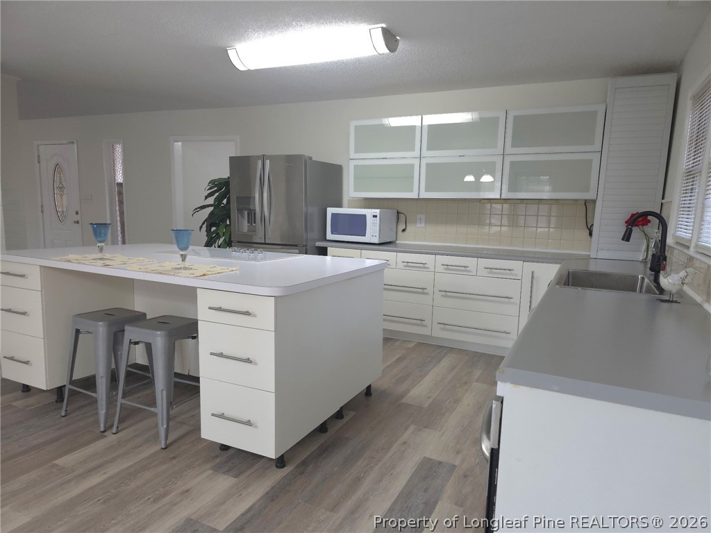 5945 Muscat Road Hope Mills, NC 28348 - Photo 14 of 36 a kitchen with a cabinets and chairs