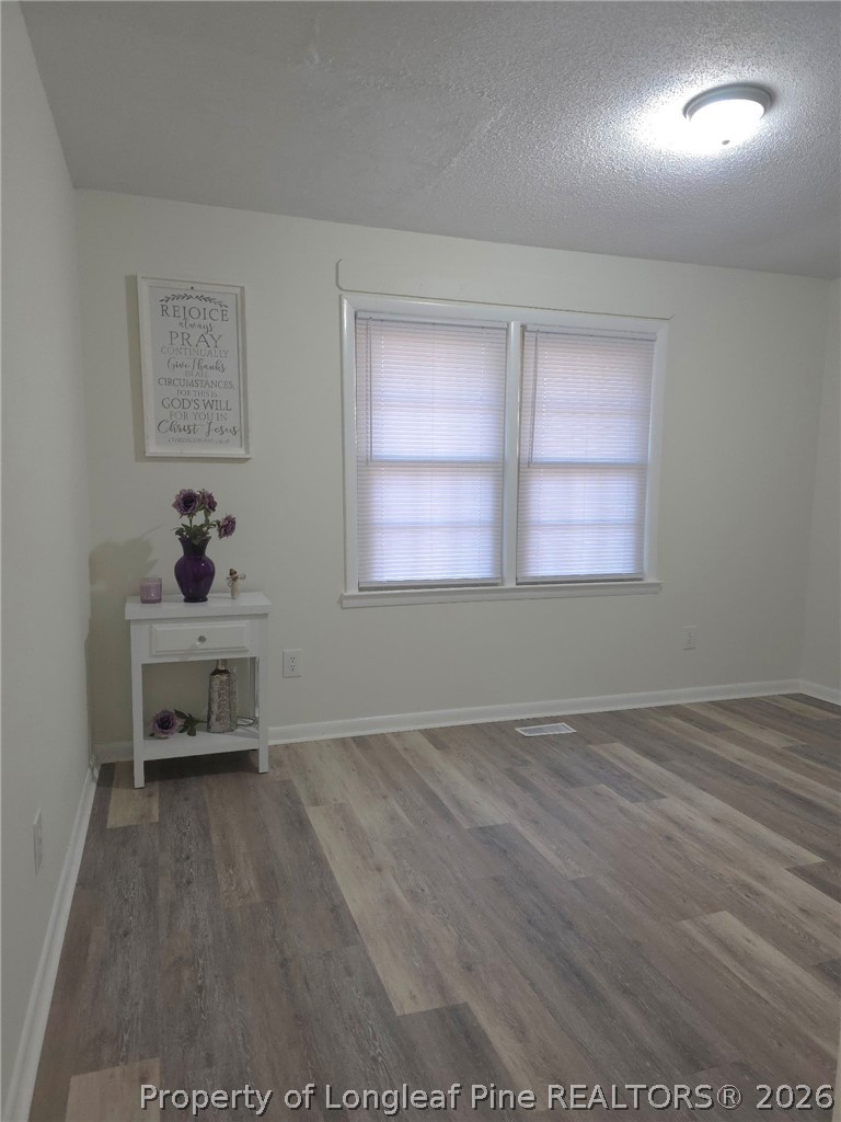 5945 Muscat Road Hope Mills, NC 28348 - Photo 16 of 36 an empty room with windows and cabinet