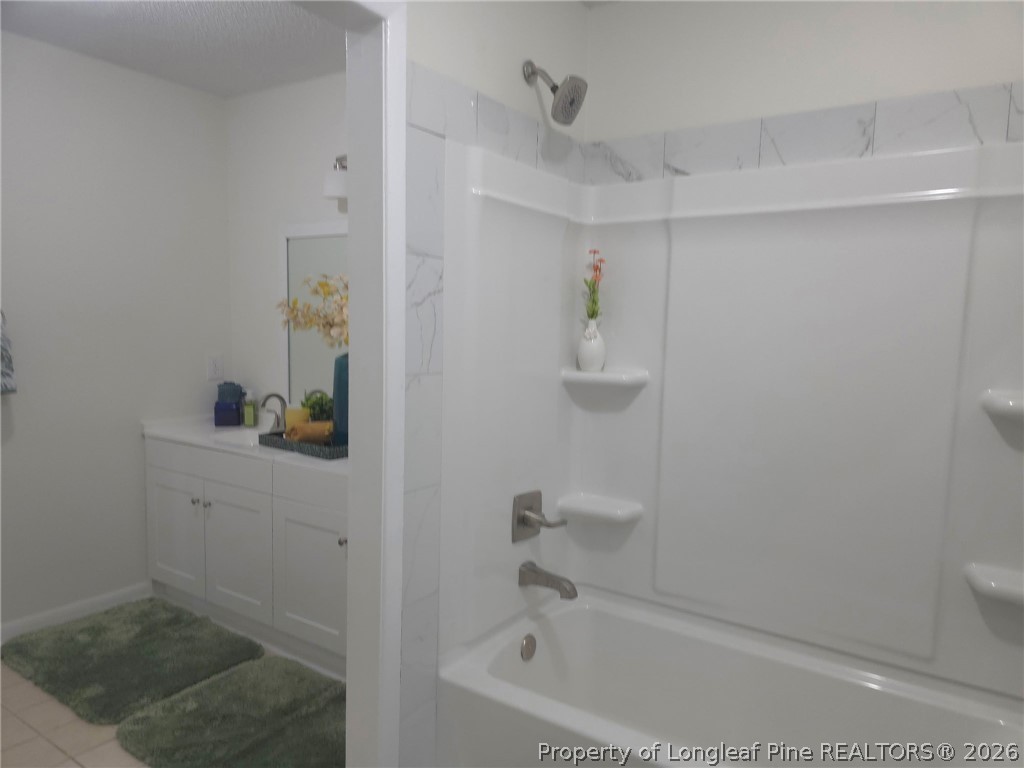 5945 Muscat Road Hope Mills, NC 28348 - Photo 18 of 36 a bathroom with a bathtub and shower