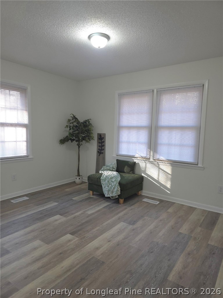 5945 Muscat Road Hope Mills, NC 28348 - Photo 20 of 36 an empty room with windows and fan