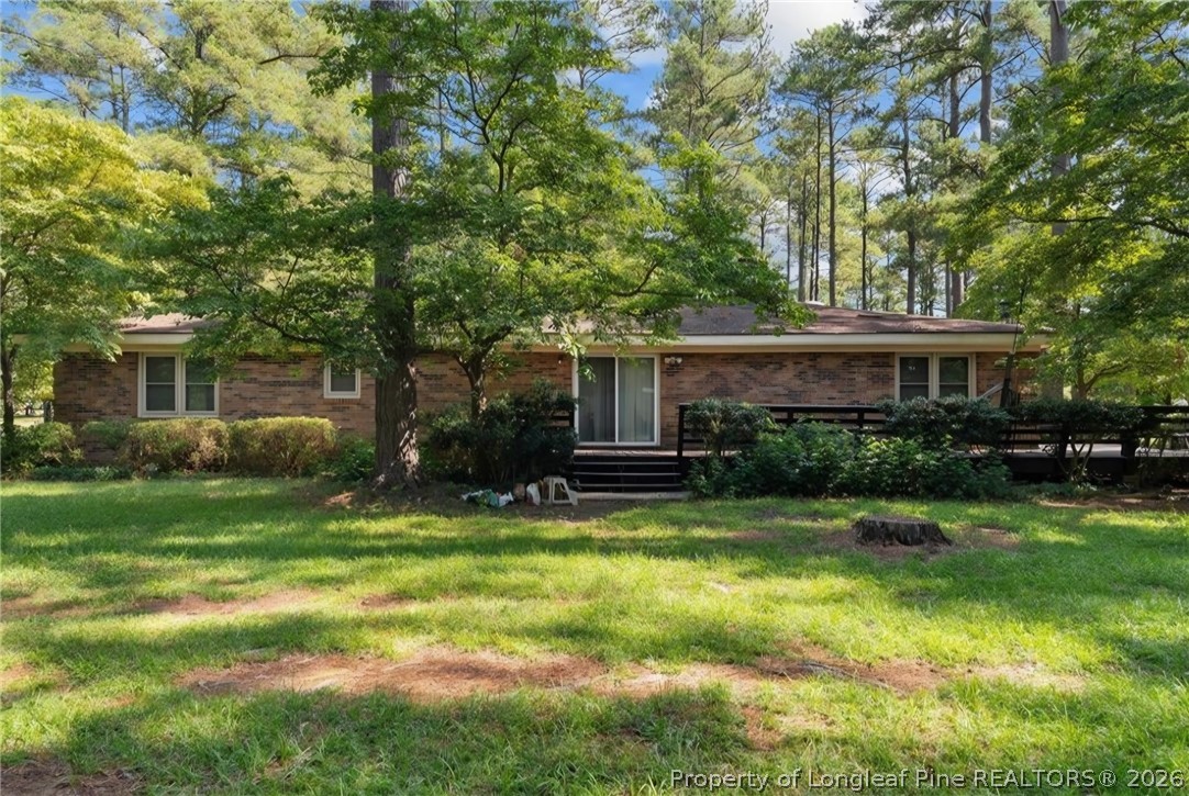 5945 Muscat Road Hope Mills, NC 28348 - Photo 27 of 36 a view of a house with a yard and tree s