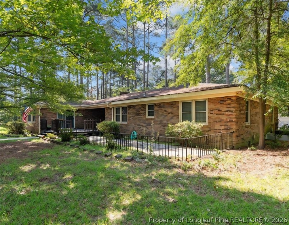 5945 Muscat Road Hope Mills, NC 28348 - Photo 4 of 36 a view of a house with a yard