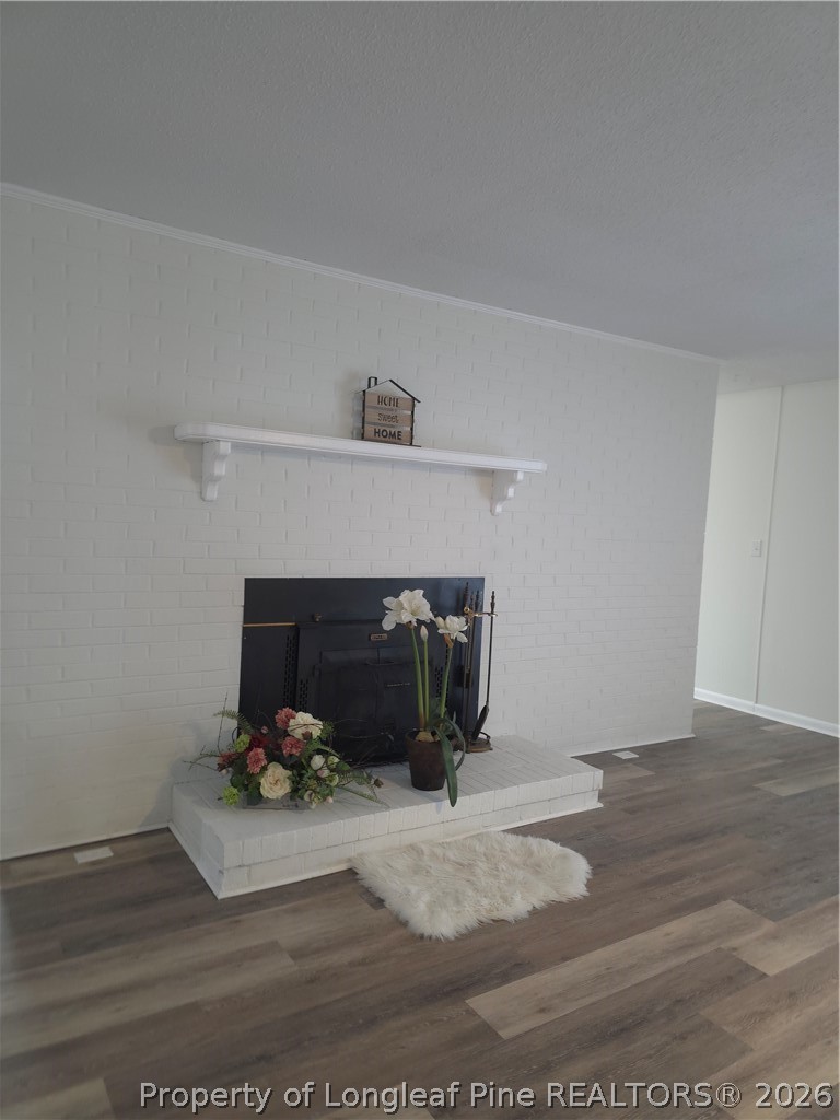 5945 Muscat Road Hope Mills, NC 28348 - Photo 8 of 36 a living room with furniture and a fireplace