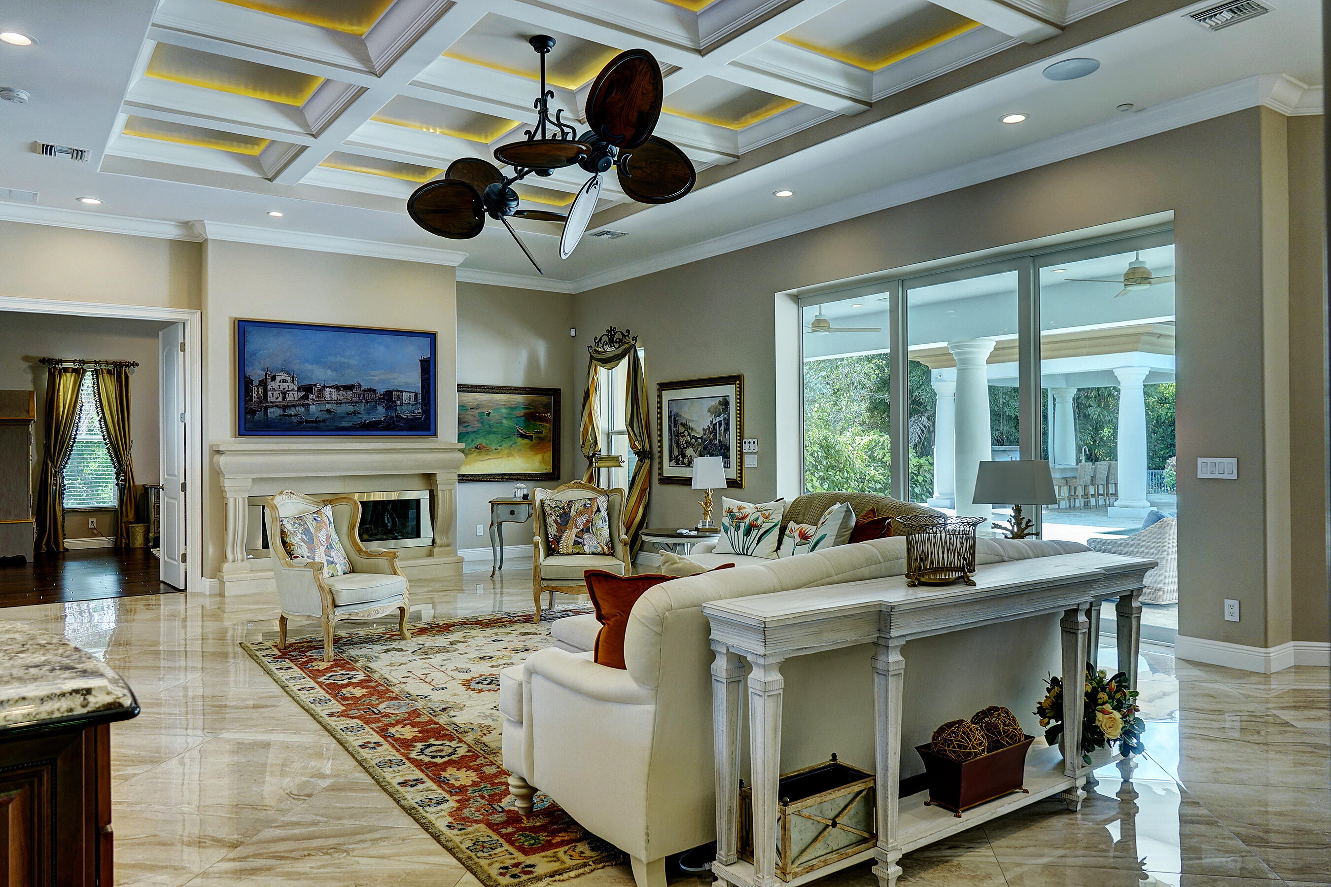 2690 Northwest Collins Cove Road Stuart, FL 34994 - Photo 16 of 78 a living room with fireplace furniture and a large window