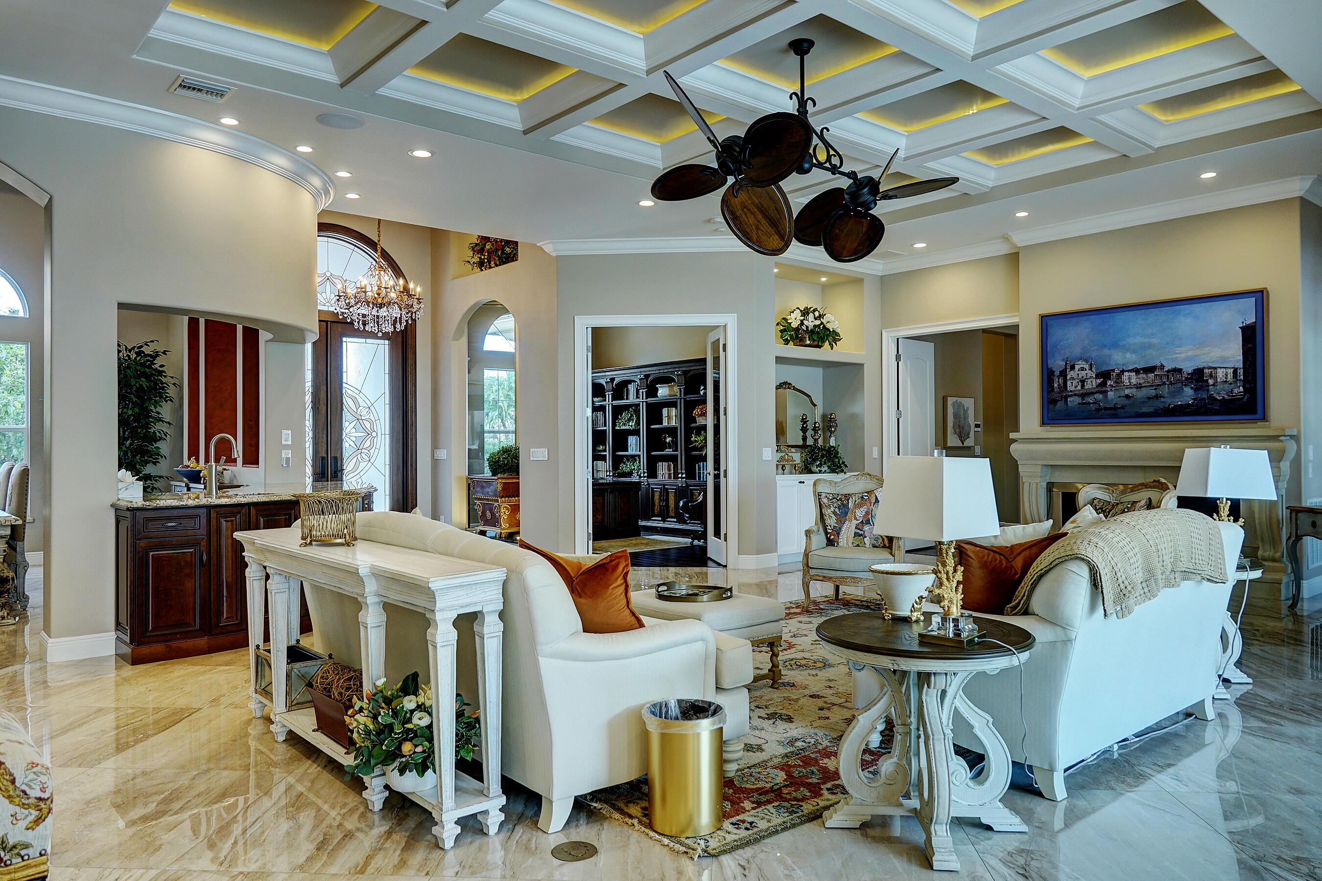 2690 Northwest Collins Cove Road Stuart, FL 34994 - Photo 17 of 78 a living room with furniture a chandelier and a flat screen tv