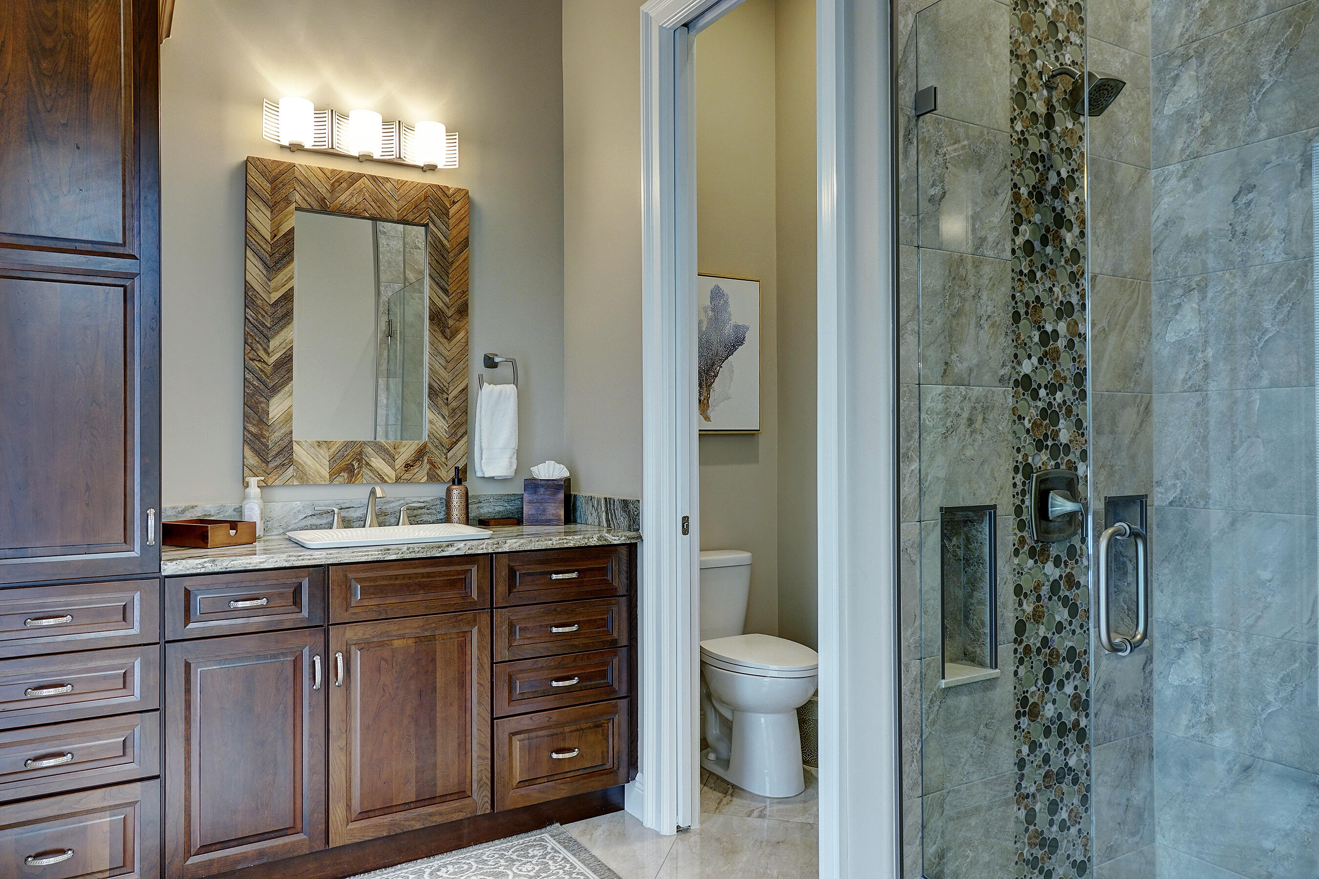 2690 Northwest Collins Cove Road Stuart, FL 34994 - Photo 30 of 78 a bathroom with a granite countertop sink a toilet and a mirror