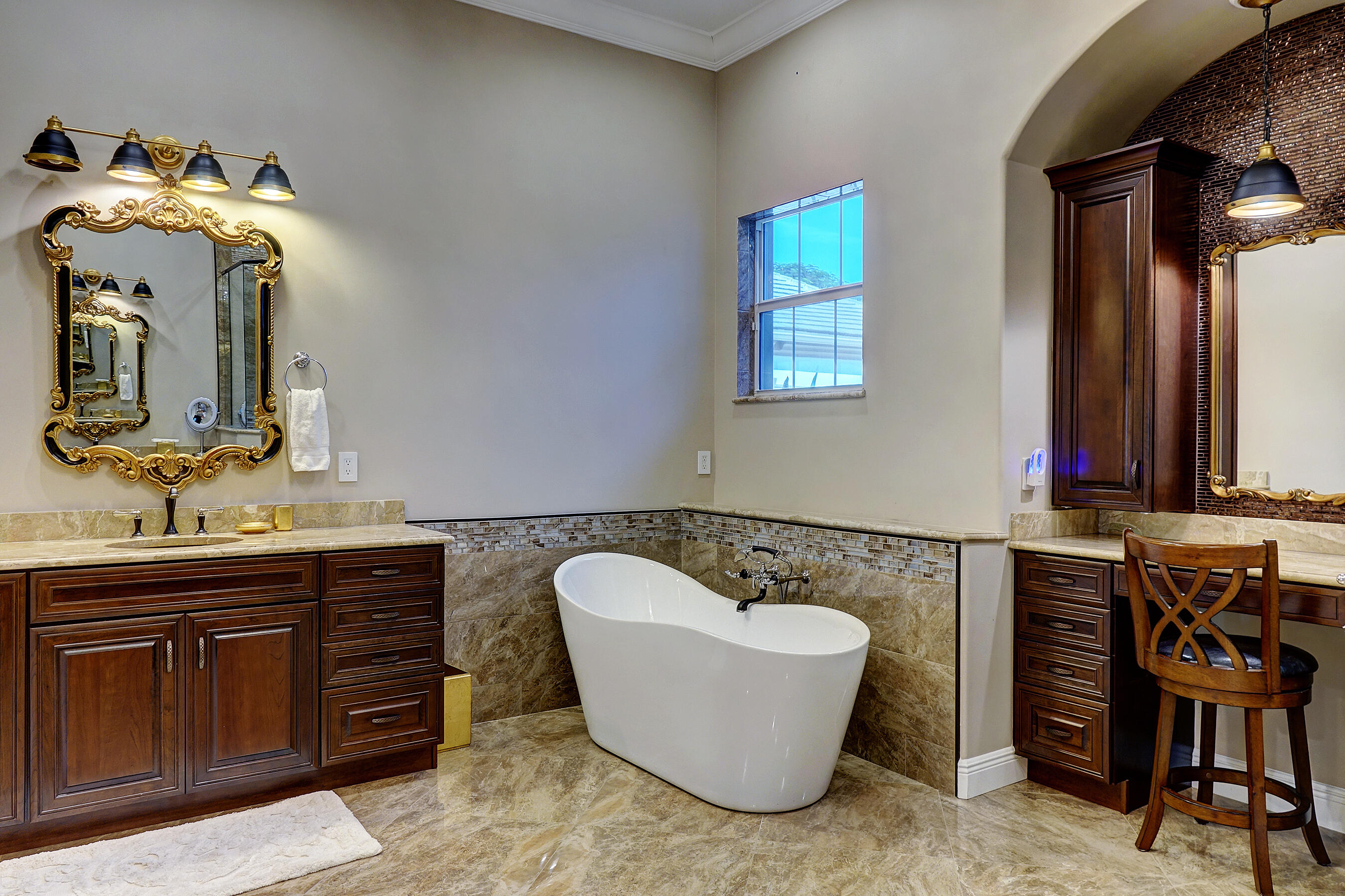 2690 Northwest Collins Cove Road Stuart, FL 34994 - Photo 36 of 78 a bathroom with a bathtub and a sink