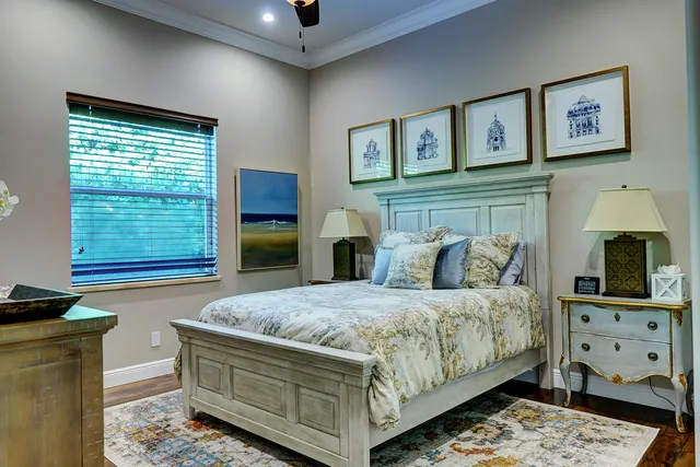 an aerial view of a house with a garden and lake view