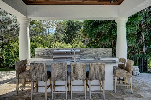 a front view of a house with yard and green space