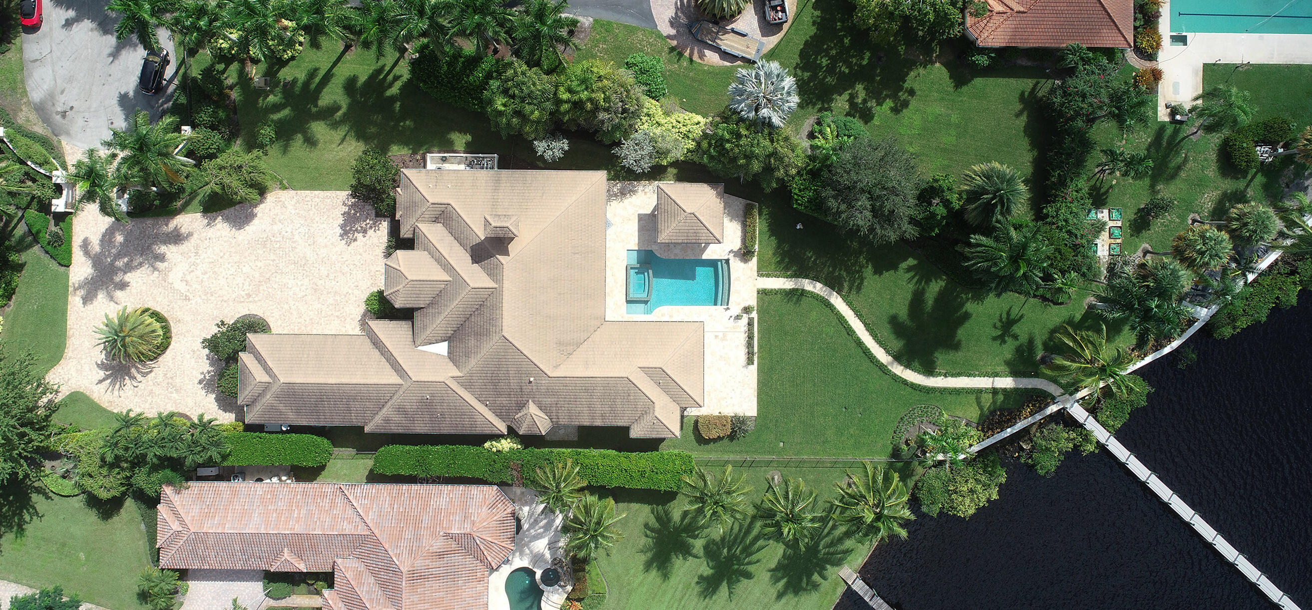 2690 Northwest Collins Cove Road Stuart, FL 34994 - Photo 65 of 78 an aerial view of a house with a garden