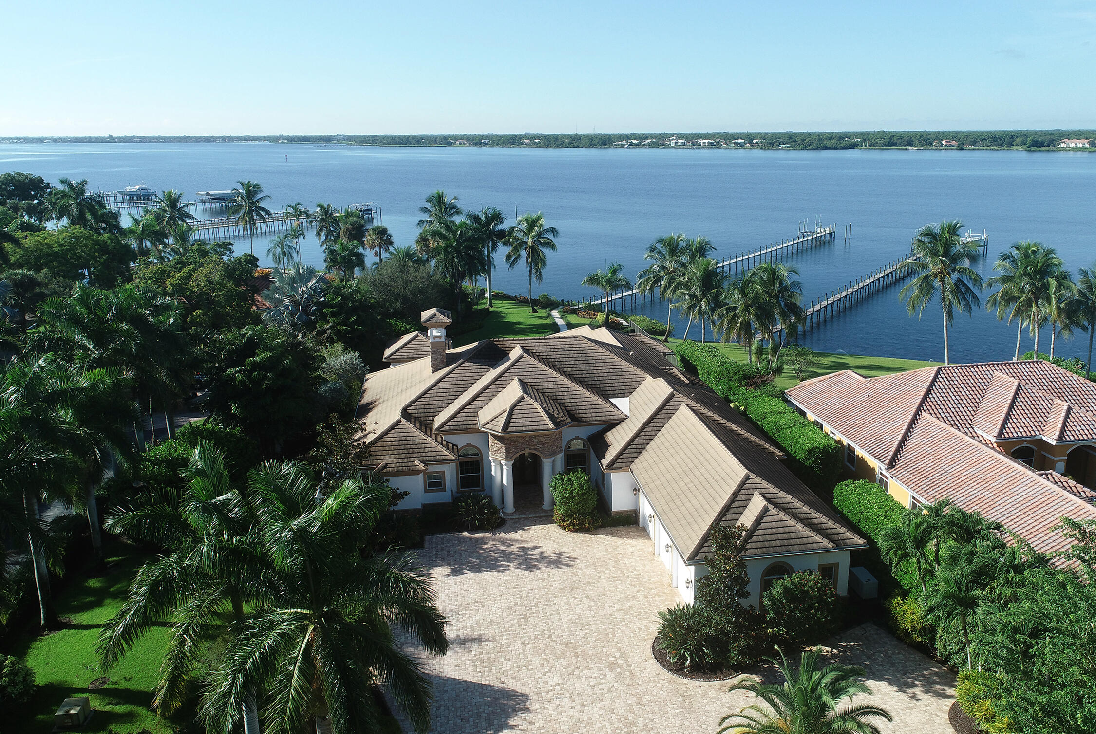 2690 Northwest Collins Cove Road Stuart, FL 34994 - Photo 69 of 78 an aerial view of a house with outdoor space and lake view
