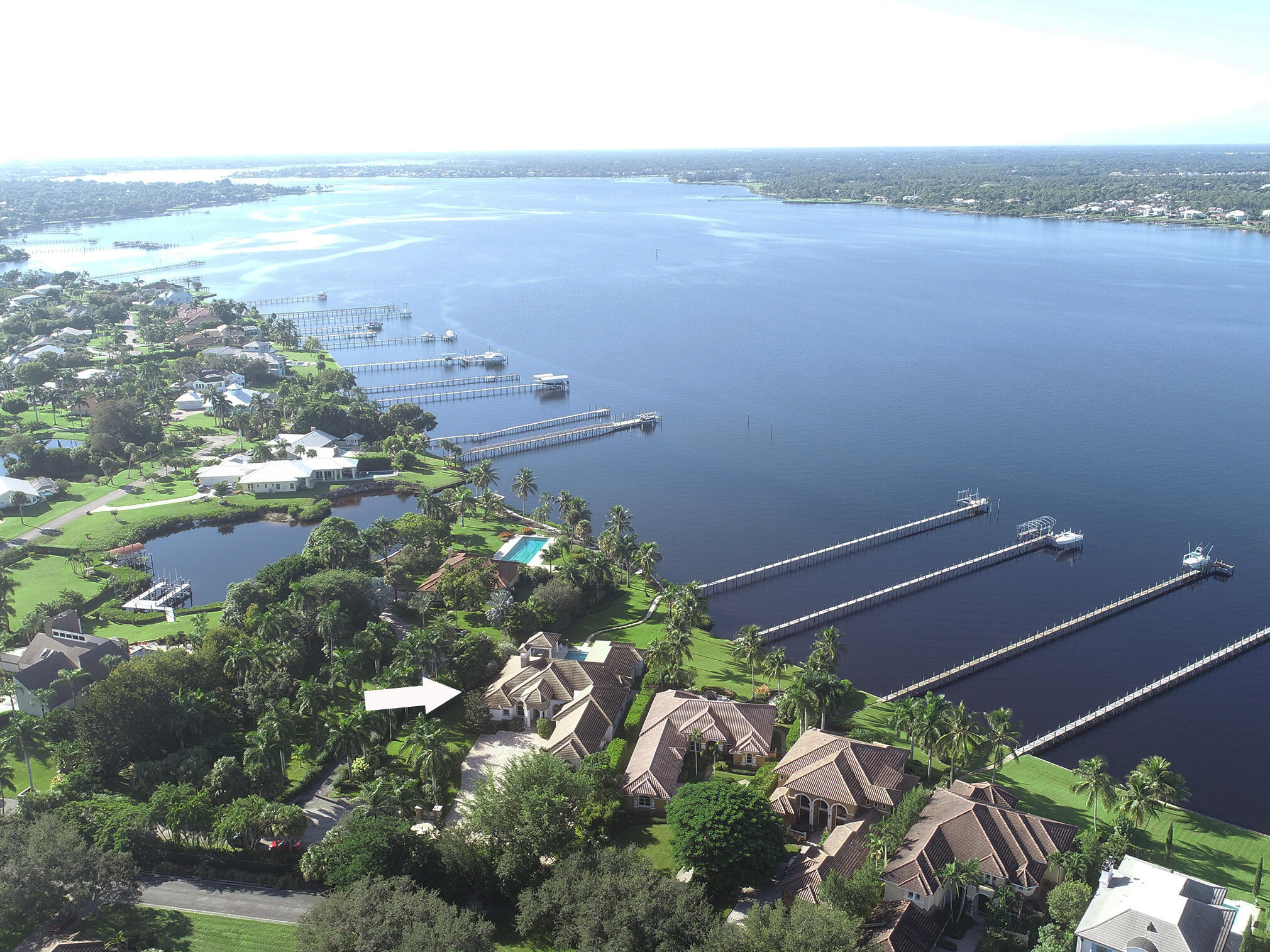 2690 Northwest Collins Cove Road Stuart, FL 34994 - Photo 73 of 78 a view of a yard and an ocean