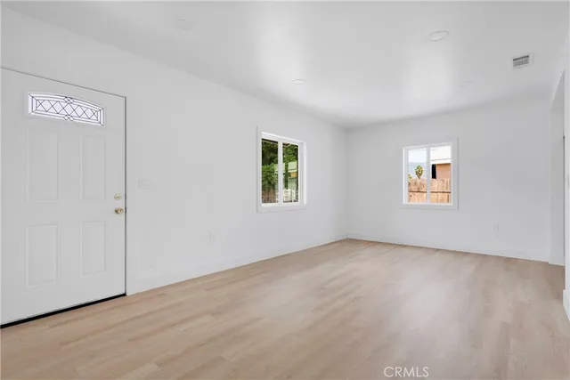 an empty room with windows