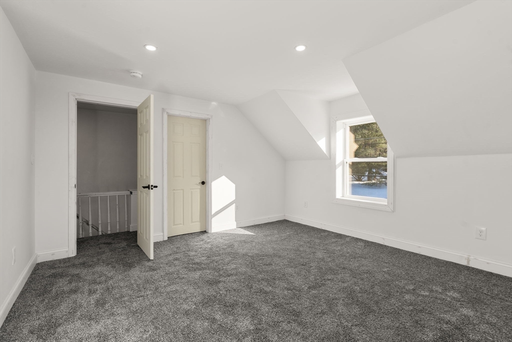 99 Main Street, Unit A Upton, MA 01568 - Photo 12 of 21 an empty room with a window and closet