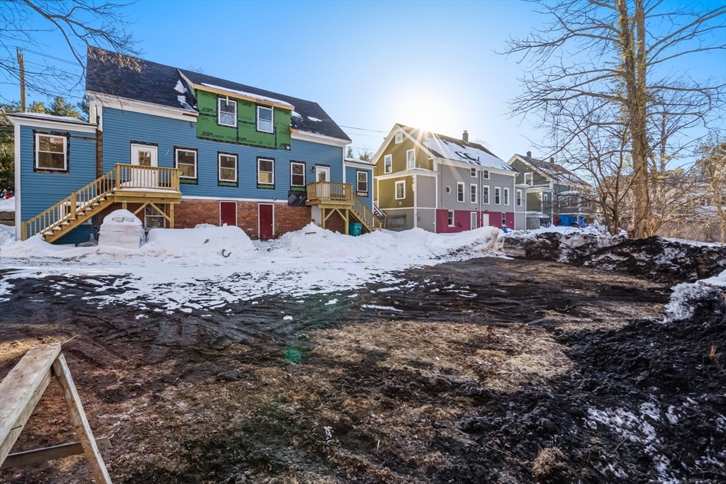 99 Main Street, Unit A Upton, MA 01568 - Photo 21 of 21 a view of multiple houses with a yard
