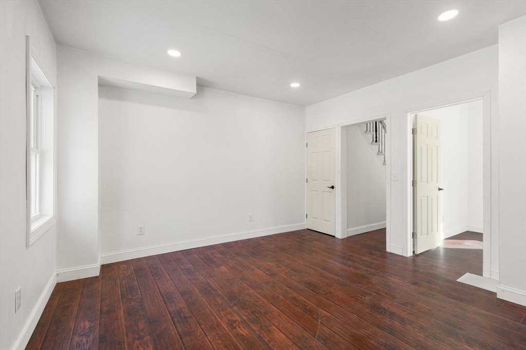 99 Main Street, Unit A Upton, MA 01568 - Photo 9 of 21 a view of an empty room with wooden floor