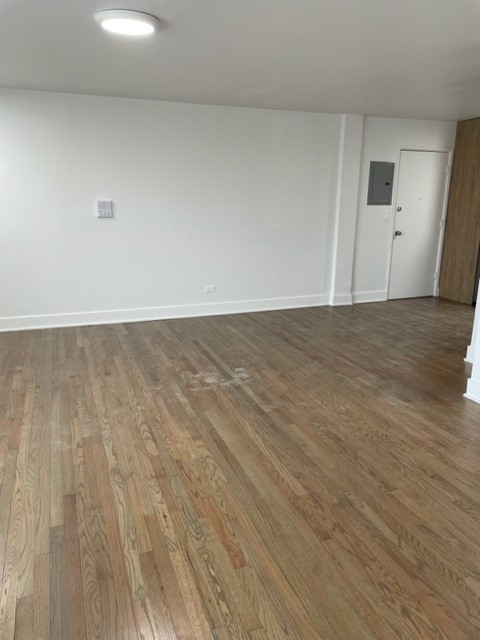7529 North Maplewood Avenue, Unit 7B Chicago, IL 60645 - Photo 8 of 10 a view of an empty room and wooden floor