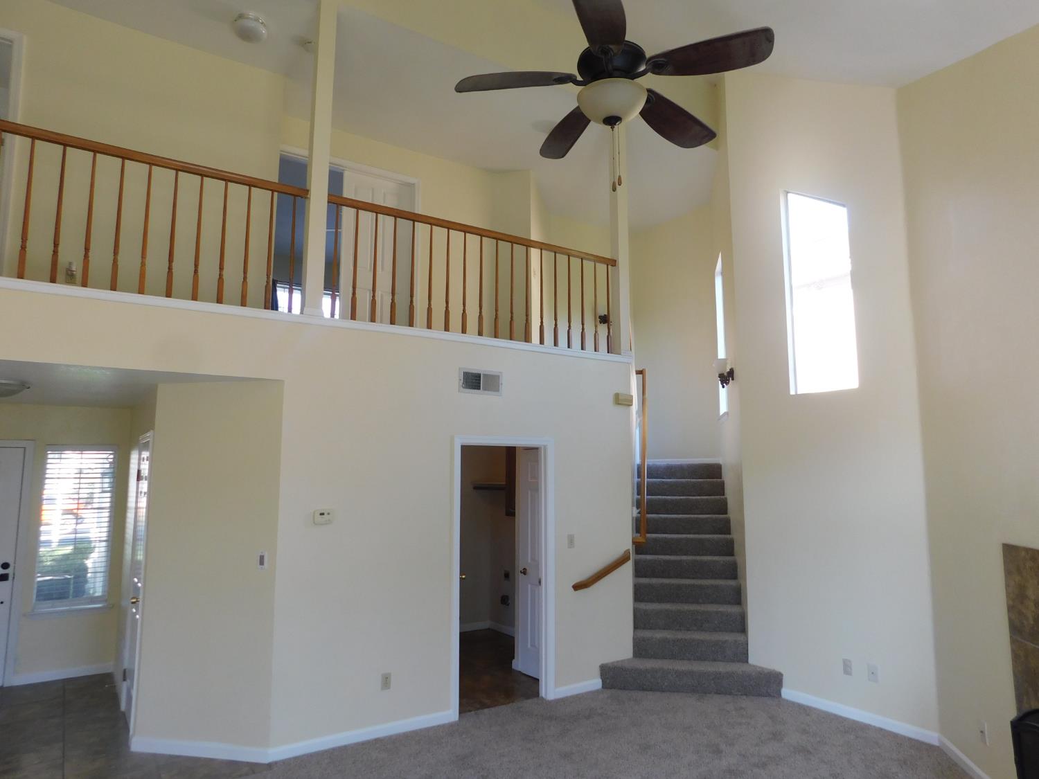 2316 Mountain Quail Way Modesto, CA 95355 - Photo 15 of 49 a view of staircase with railing and white walls