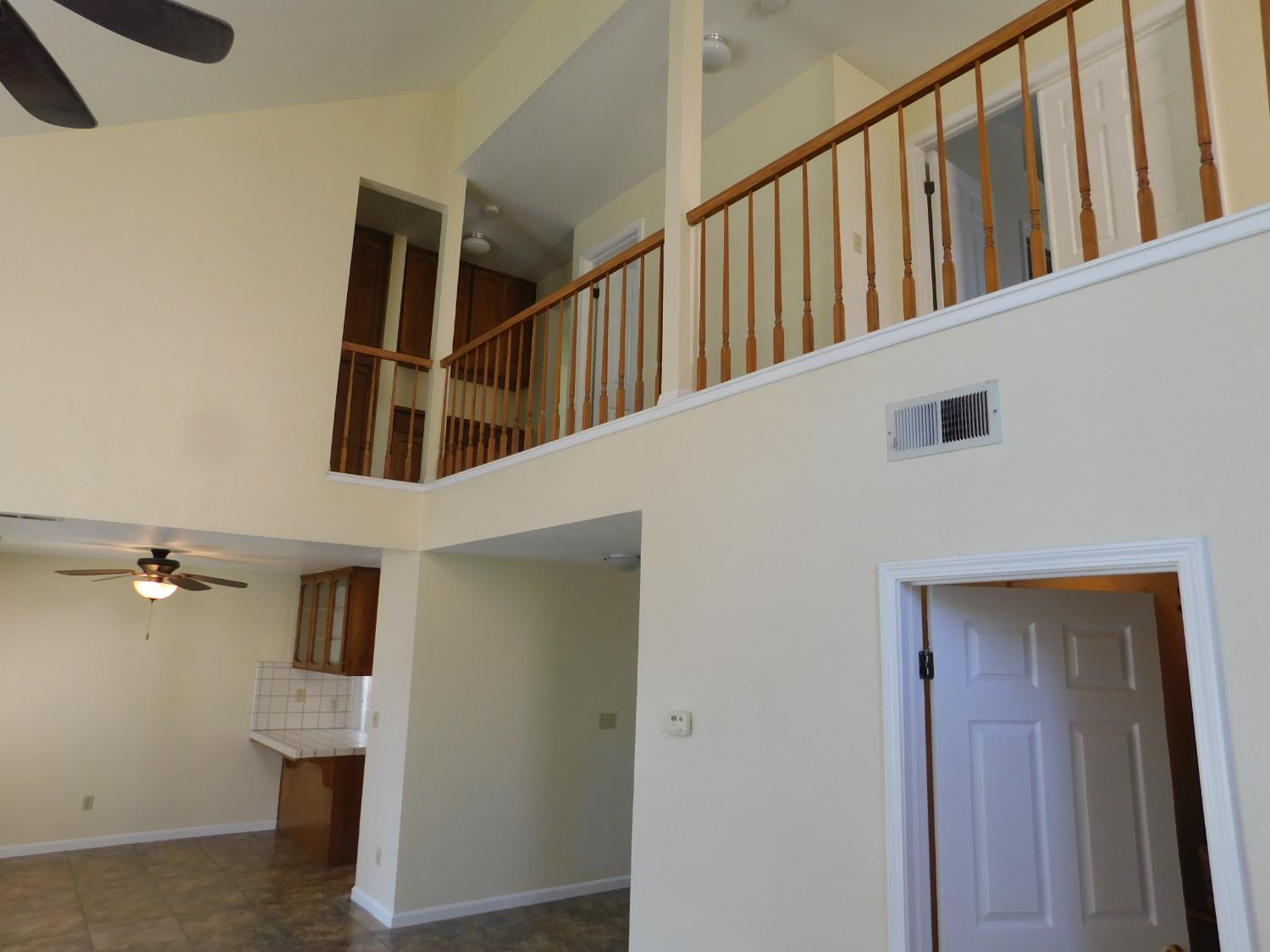 2316 Mountain Quail Way Modesto, CA 95355 - Photo 16 of 49 a view of staircase with lots of frames on wall and stairs