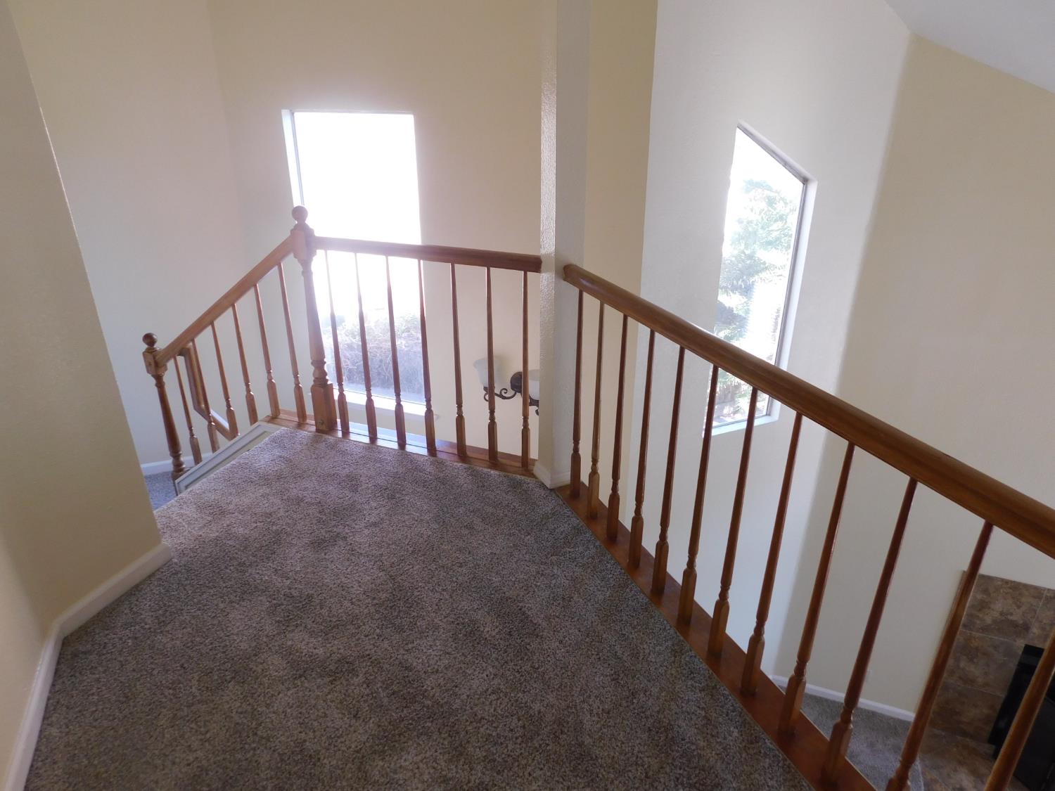 2316 Mountain Quail Way Modesto, CA 95355 - Photo 19 of 49 a view of a hallway with windows