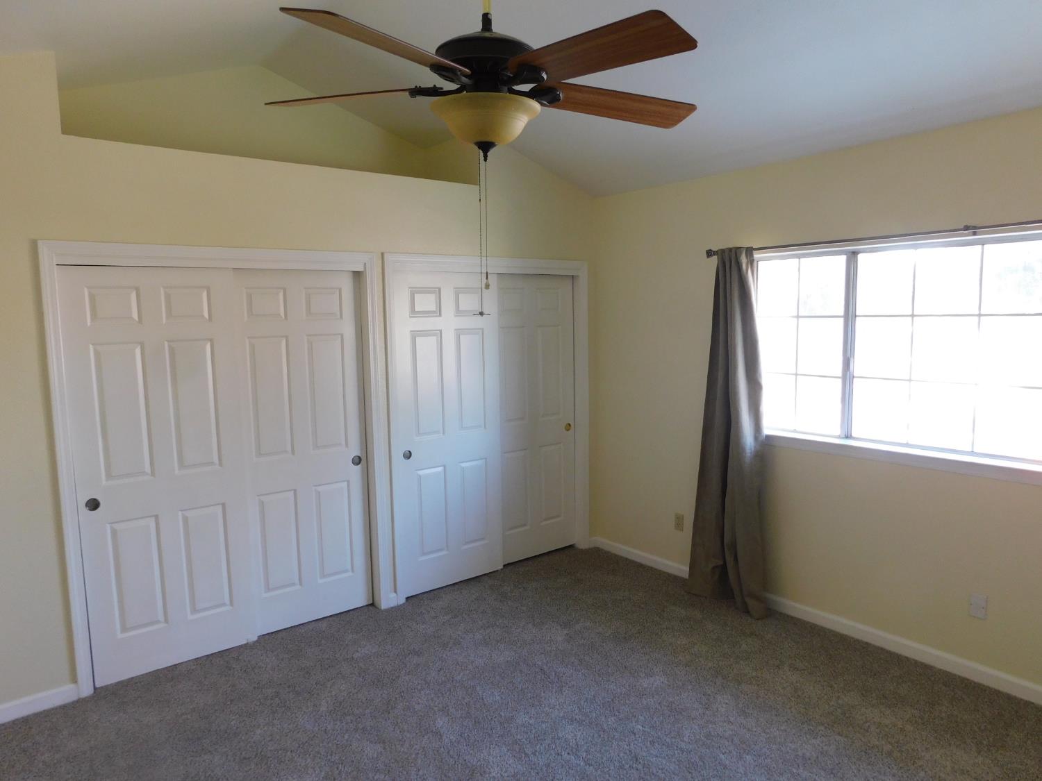 2316 Mountain Quail Way Modesto, CA 95355 - Photo 21 of 49 a view of an empty room with a window