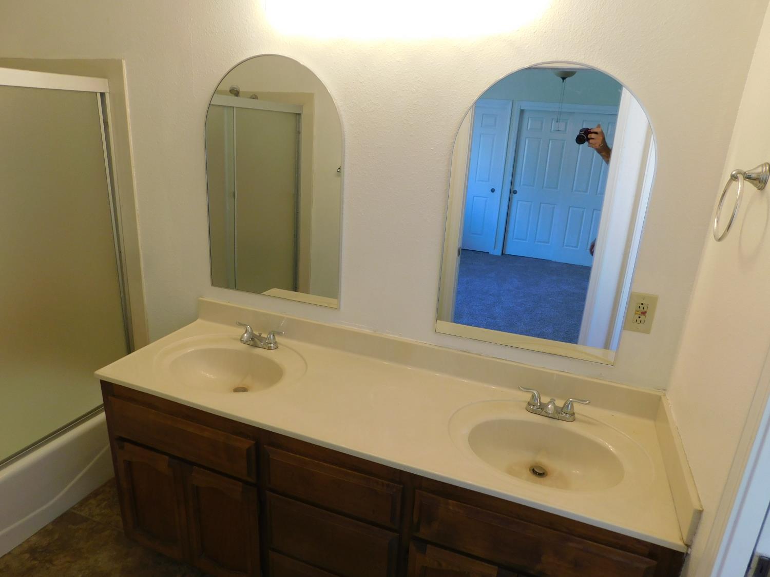 2316 Mountain Quail Way Modesto, CA 95355 - Photo 24 of 49 a bathroom with a sink and a mirror