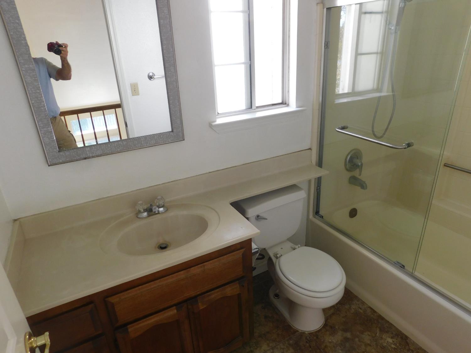 2316 Mountain Quail Way Modesto, CA 95355 - Photo 28 of 49 a bathroom with a sink a toilet and shower