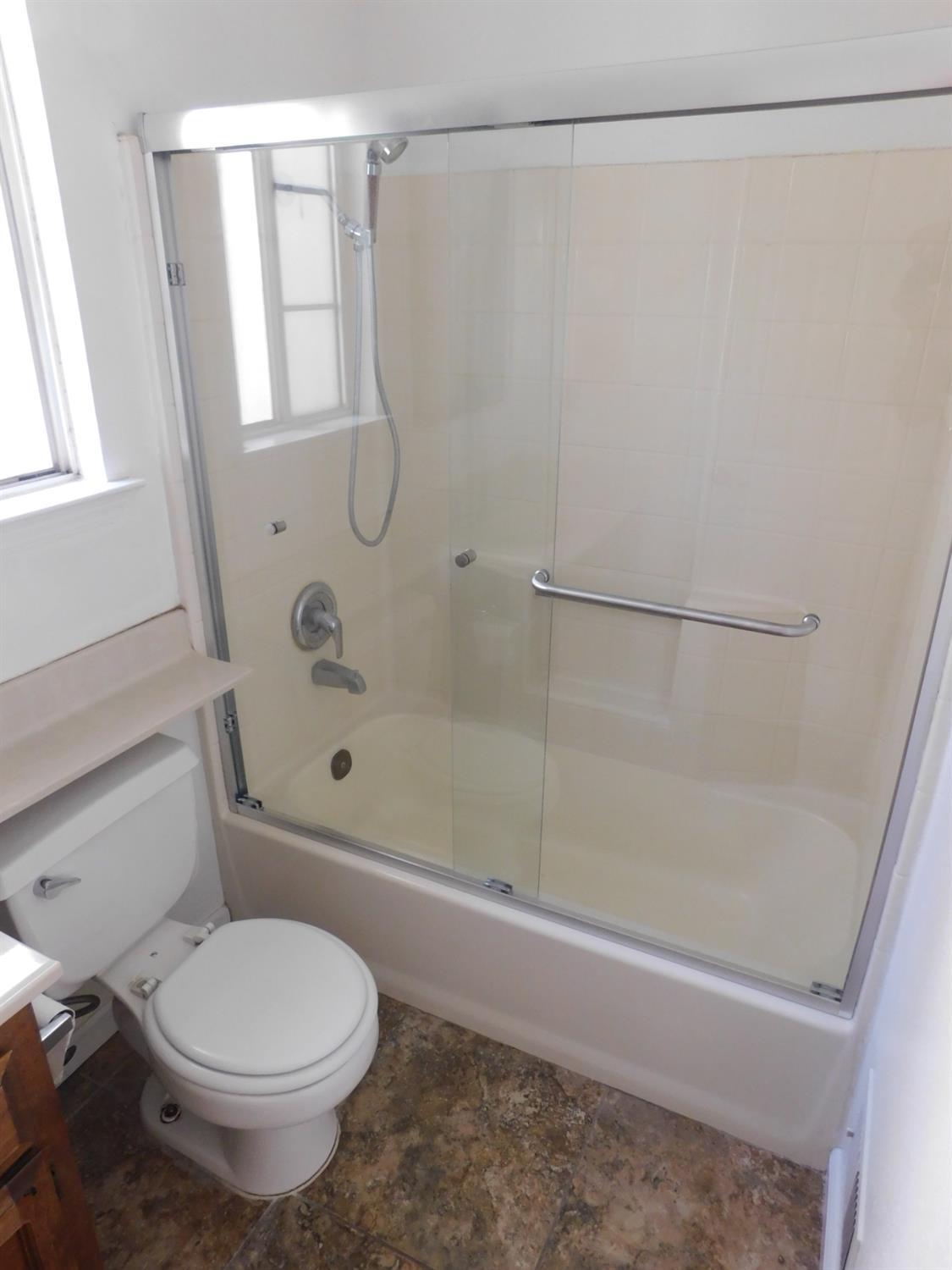 2316 Mountain Quail Way Modesto, CA 95355 - Photo 30 of 49 a bathroom with a toilet and a shower