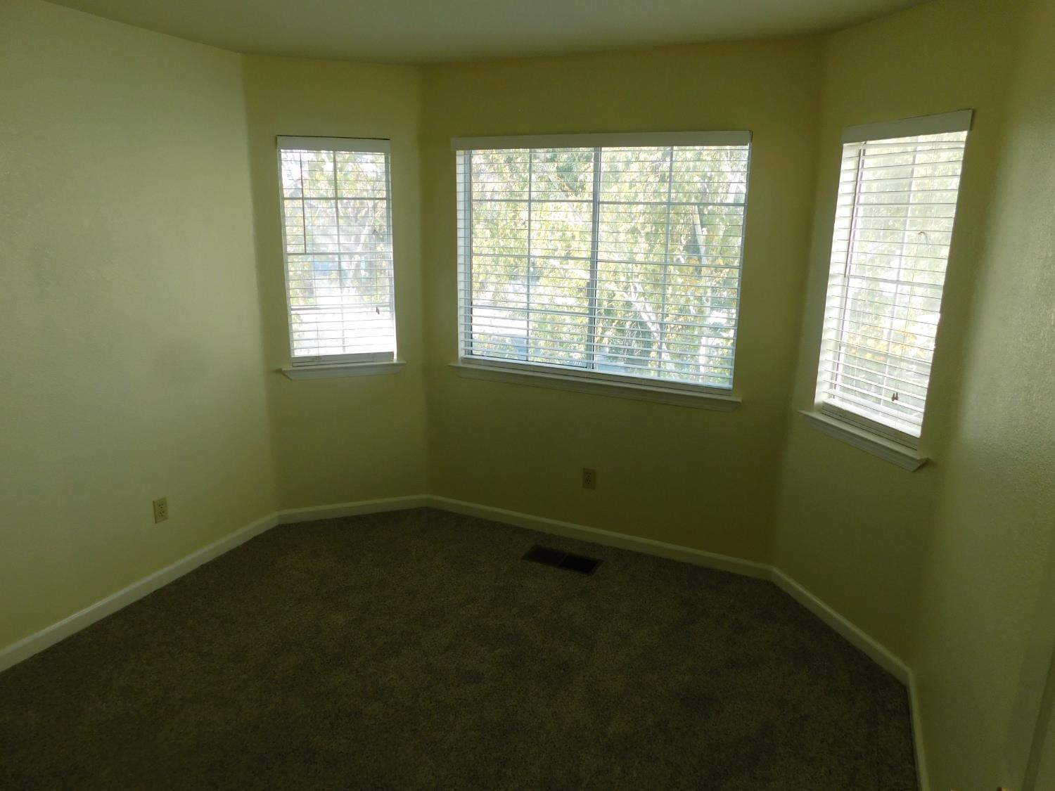 2316 Mountain Quail Way Modesto, CA 95355 - Photo 32 of 49 a view of an empty room with a window