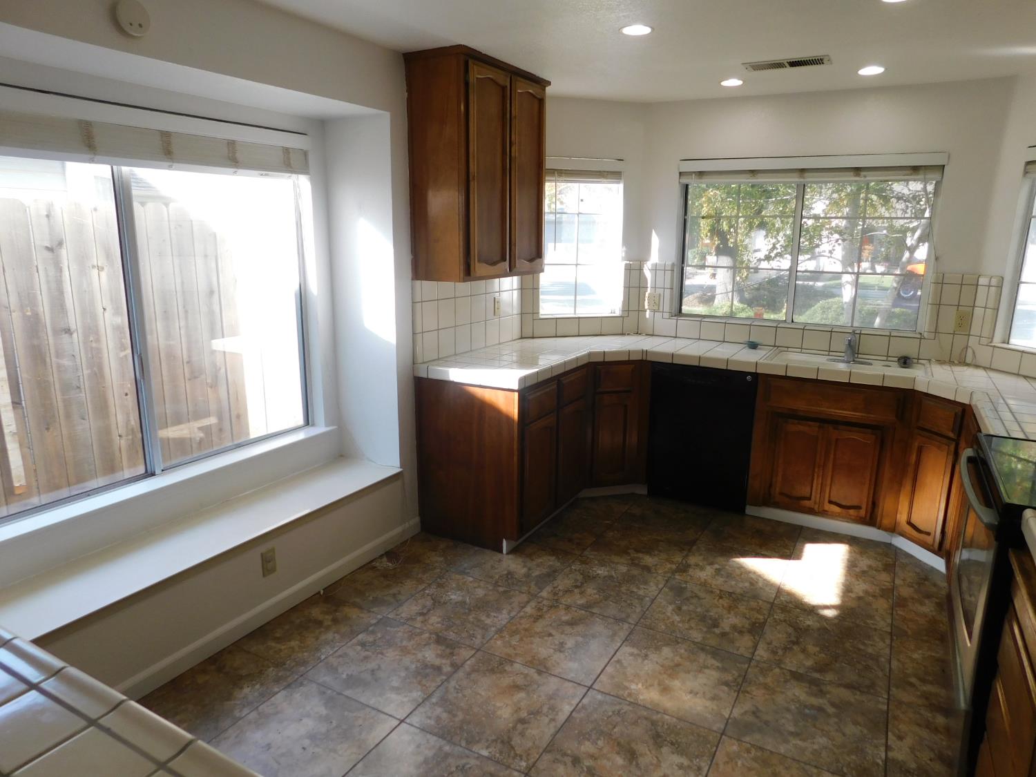 2316 Mountain Quail Way Modesto, CA 95355 - Photo 7 of 49 a large kitchen with stainless steel appliances granite countertop a refrigerator and a sink