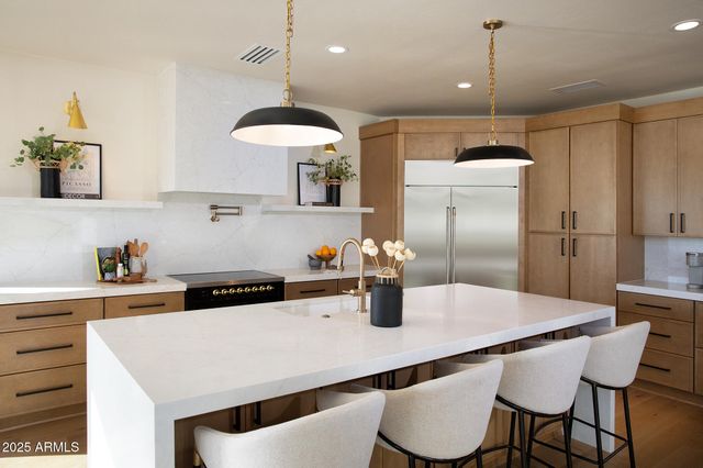 a kitchen with a stove and cabinets