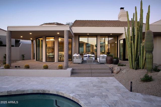 a view of a house with a yard and garage